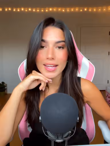 Whisper style ASMR portrait with warm lights and close microphone setup.